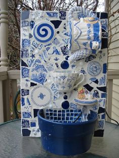 A fountain of teapot and tea cups