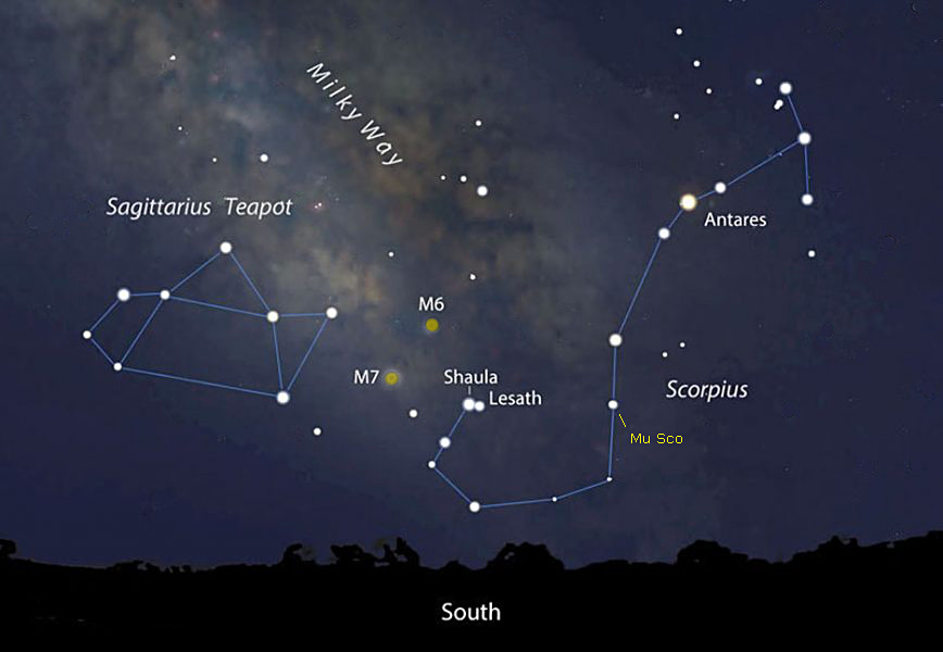 Annotated night sky showing Scorpius and The Teapot constellations, Antares, 3 Sgr, and the Galactic center above a dark horizon.