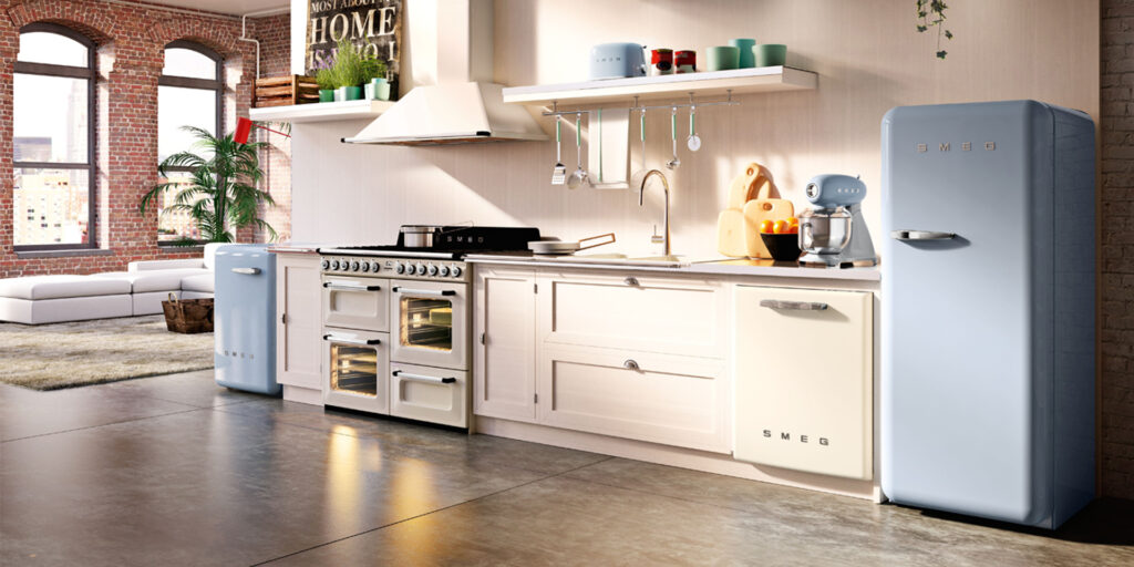 White retro kitchen with off white cupboards, retro white oven, and a blue vintage-style refrigerator.