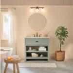 Earth tone bathroom with green cabinet and white tub.