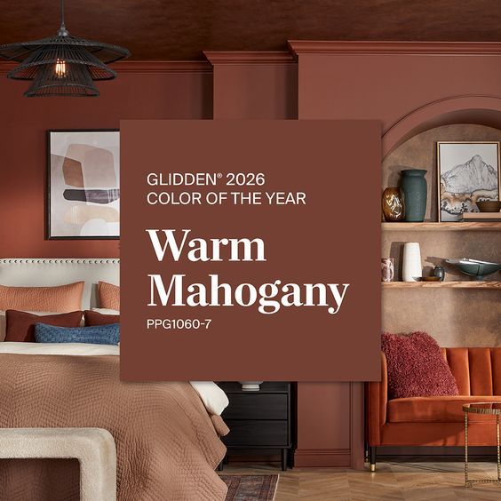 The image announces the Glidden 2026 Color of the Year, which is a rich, warm-toned red called Warm Mahogany. 