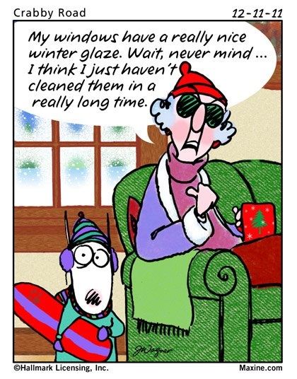 A comic strip titled "Crabby Road" dated 12-11-11. The main character, Maxine, is seated in a green armchair, wearing a red hat, scarf, and sunglasses, next to a snowy window. She is holding a small red gift box. A second character in winter gear, holding a red and purple snowboard, stands next to her. A speech bubble from Maxine reads: "My windows have a really nice winter glaze. Wait, never mind... I think I just haven't cleaned them in a really long time."